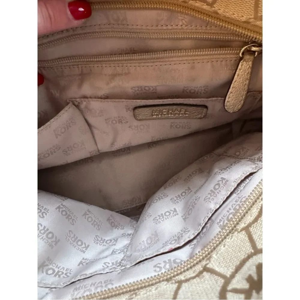 Michael Kors Small Monogrammed Leather Tote featuring the brand's signature logo